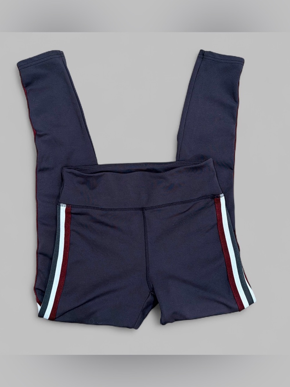 Leggings with white and red stripe detail down the sides